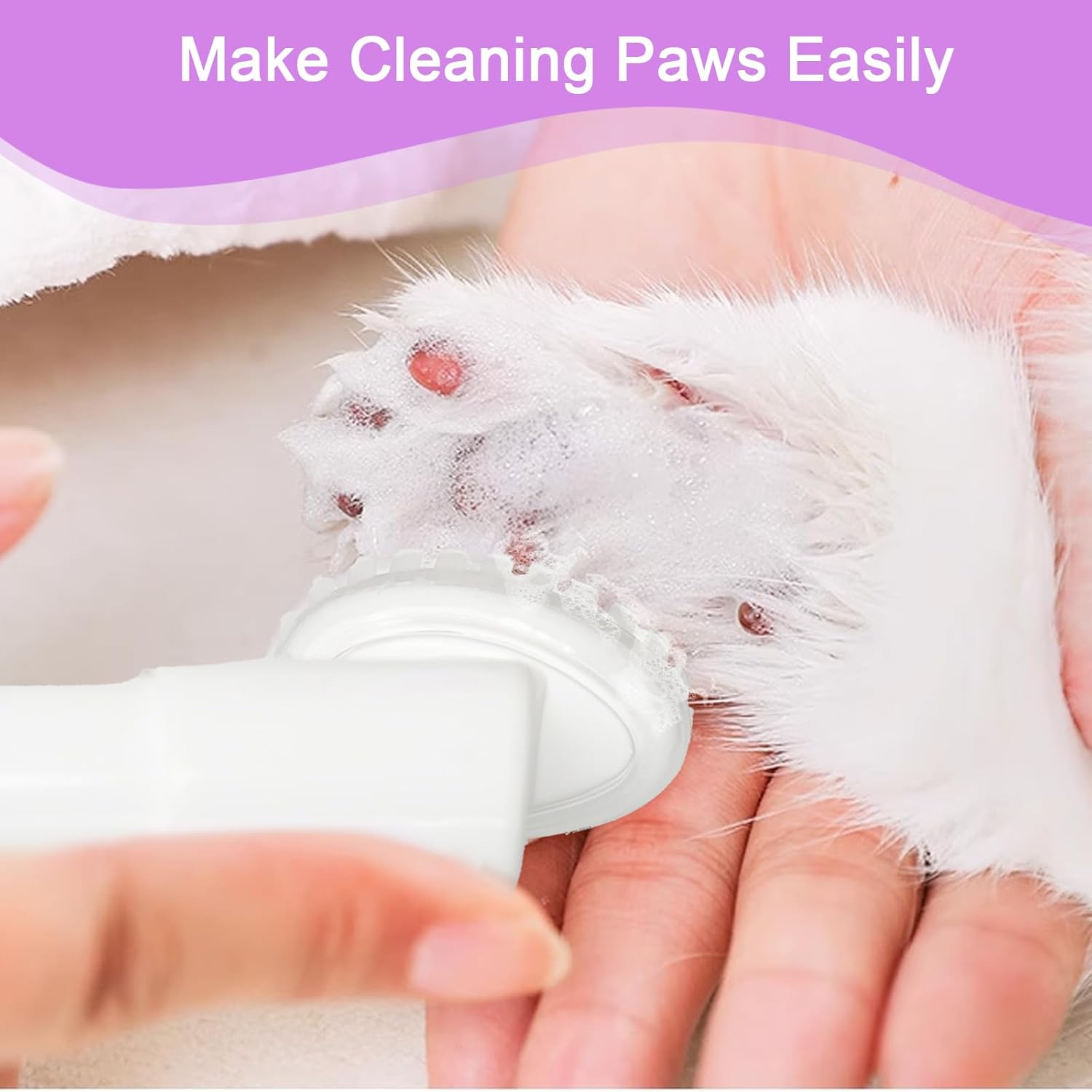 Foaming cleanser applied to a dog's paw, demonstrating easy and efficient cleaning for pets.