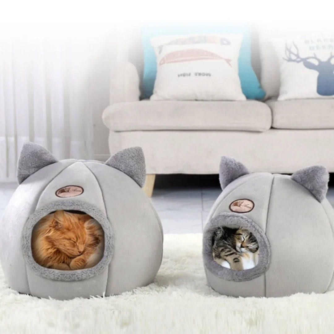 Pet bed with cat ears, warm plush design for cats, machine washable.